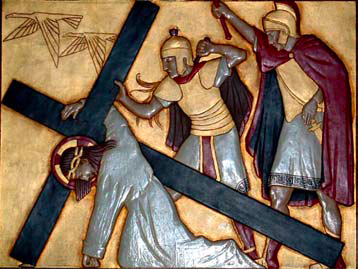The third Station: Jesus falls under the heavy cross